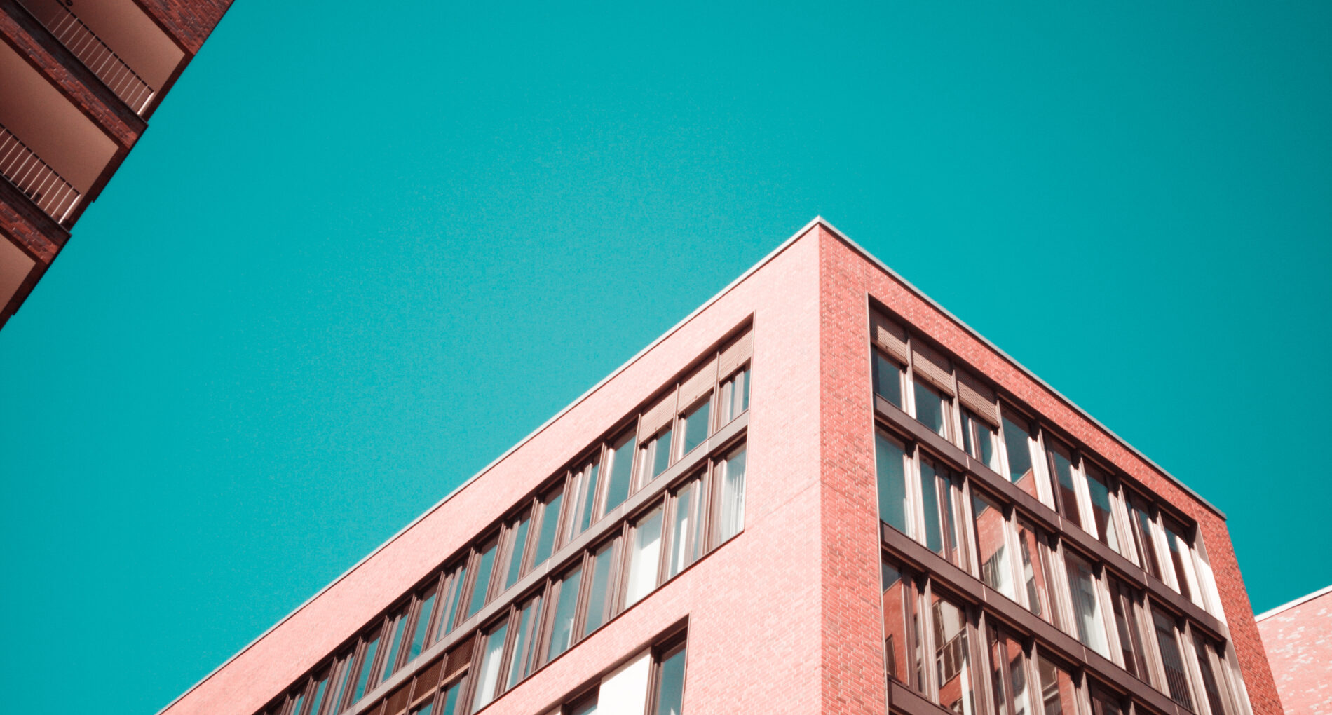 low-angle photography of red concrete building